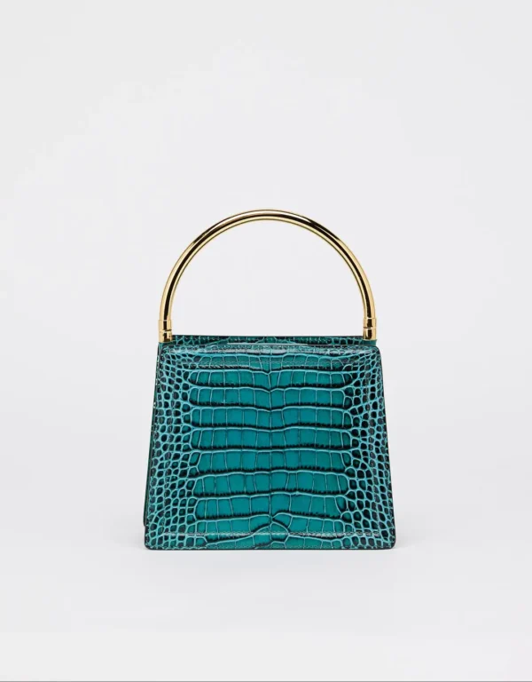 This beautiful leather handbag is perfect for any sophisticated woman who wants to make a statement. The croco print is eye-catching and unique, while the gold details add a touch of luxury. The detachable long strap makes it easy to carry, and the Nora's print adds a touch of personality.