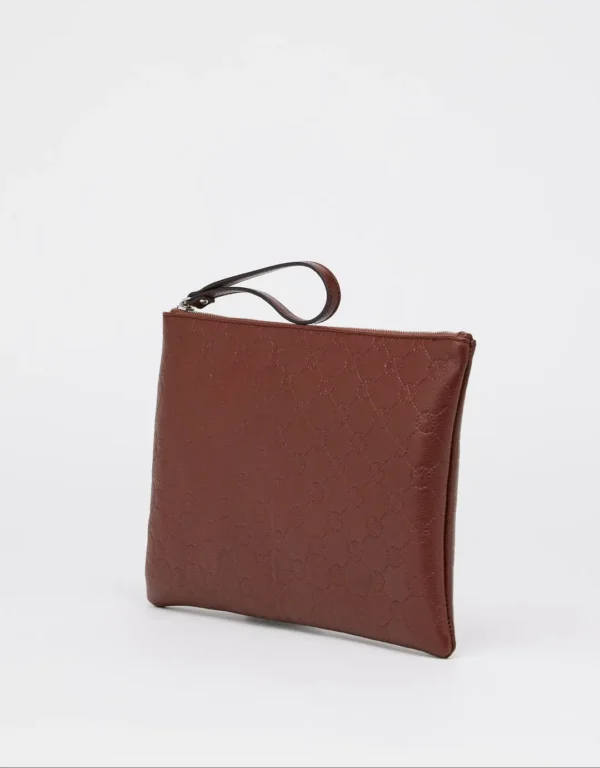 Pochette Arabesque is a handmade modern piece made of Tuscany high quality calf leather embossed with the Moroccan mosaic pattern. Worn as a clutch during the day or in the evening, or slipped into a larger bag. This model closed with interior compartments can also accommodate office essentials such as documents or a tablet.