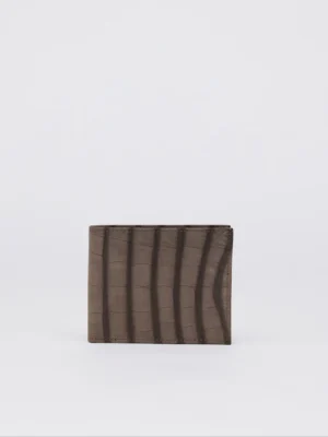 This beautiful wallet is Pleasantly compact and thin, this leather wallet will hold your essentials and slip easily into a pocket. The Croco print on this wallet makes it look elegant and timeless. It has a minimalist design and is made of high-quality calf leather. It has eight card slots and two compartments for bills.