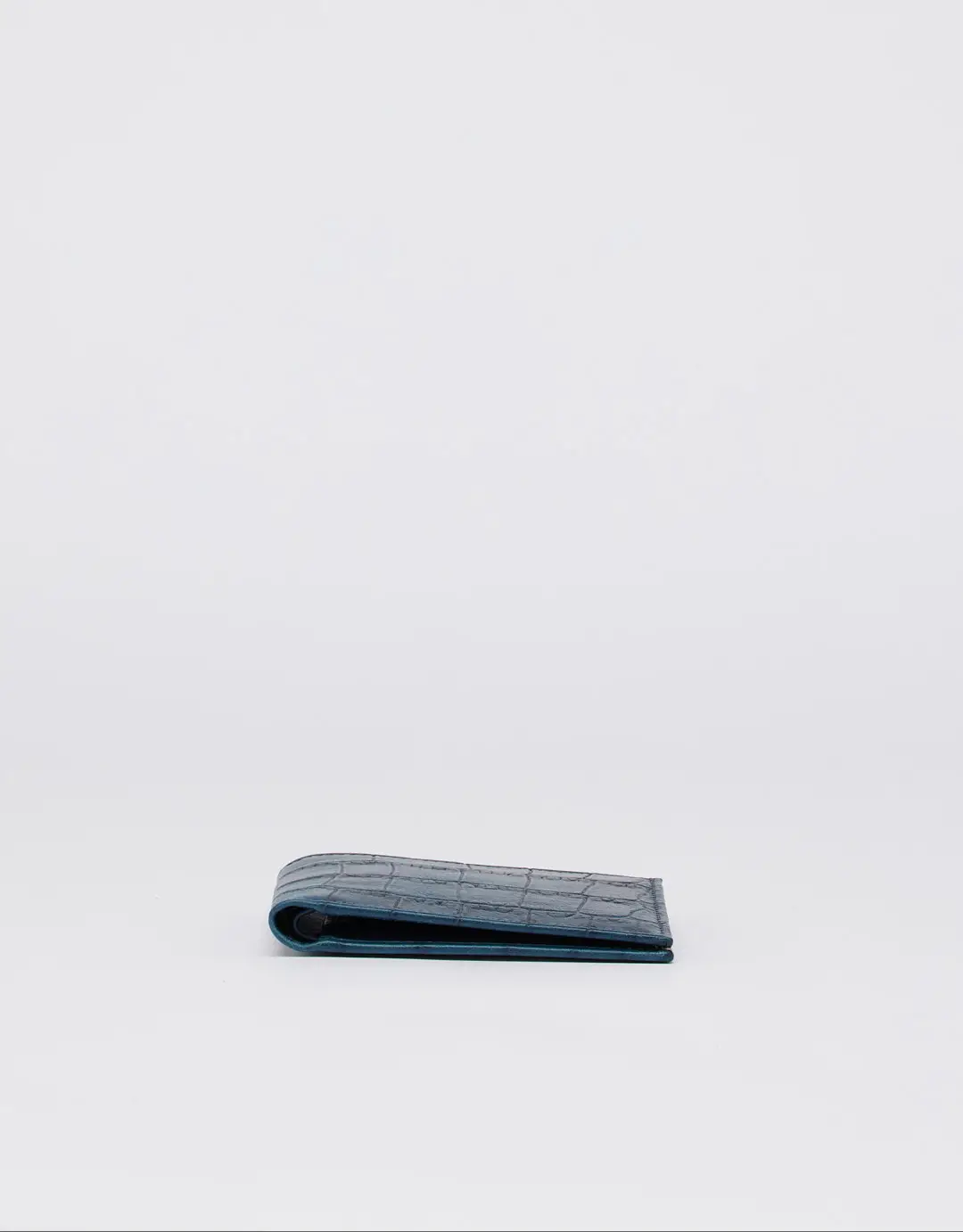 This beautiful wallet is Pleasantly compact and thin, this leather wallet will hold your essentials and slip easily into a pocket.
The Croco print on this wallet makes it look elegant and timeless. It has a minimalist design and is made of high-quality calf leather. It has eight card slots and two compartments for bills.